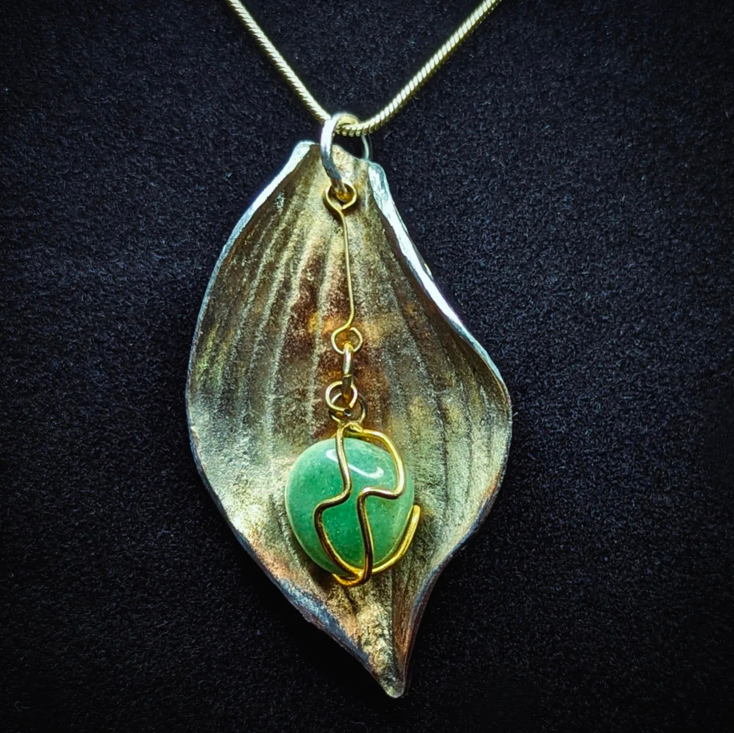 Aventurine, silver, and gold leaf pendant